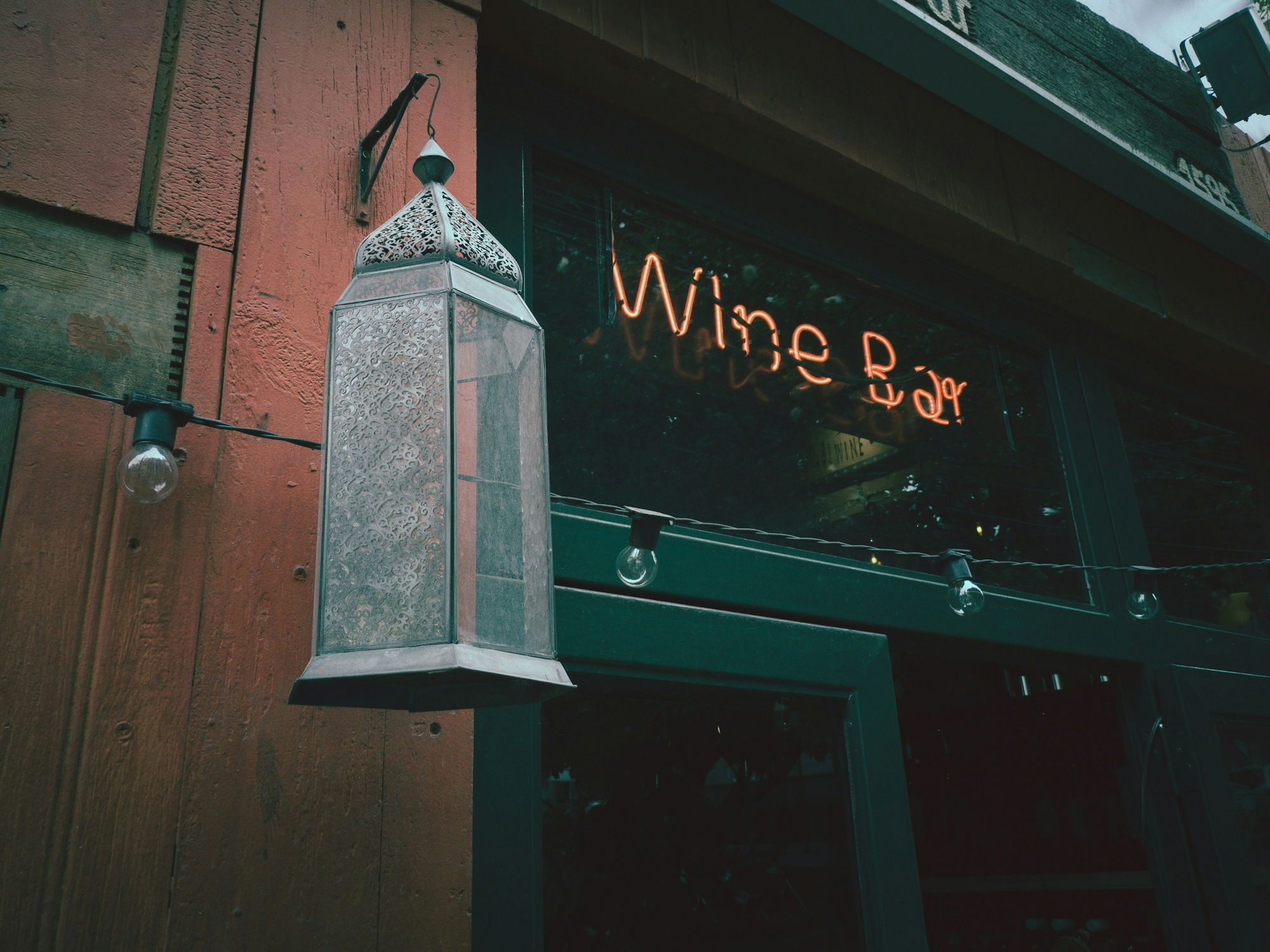 lighted-wine-bar-signage-during-daytime.jpg lighted wine bar signage during daytime